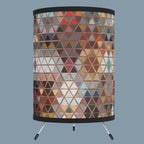 A tripod table lamp with a modern geometric pattern design 
