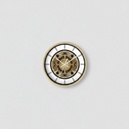 Decorative wall clock with intricate design on a textured brown wall with a plant.